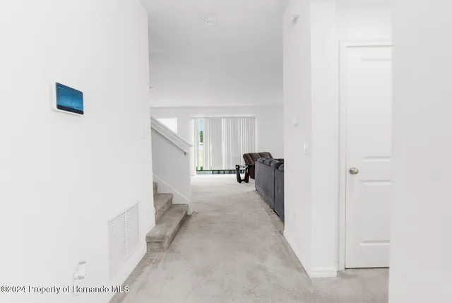 a view of a room with a hallway