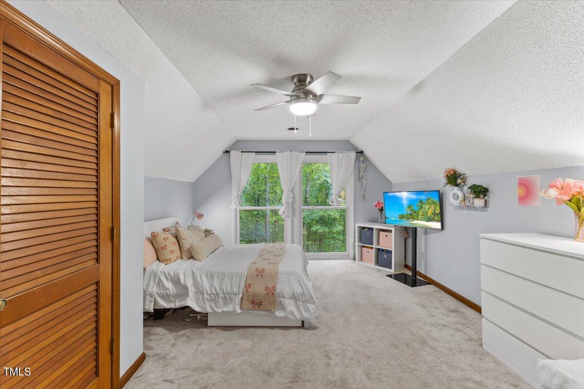 6713 Laurdane Road Raleigh, NC 27613 - Photo 19 of 47 a bed room with a bed and a window