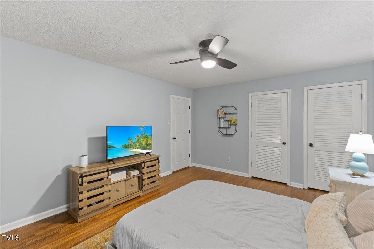 6713 Laurdane Road Raleigh, NC 27613 - Photo 24 of 47 a bedroom with a bed and a dresser
