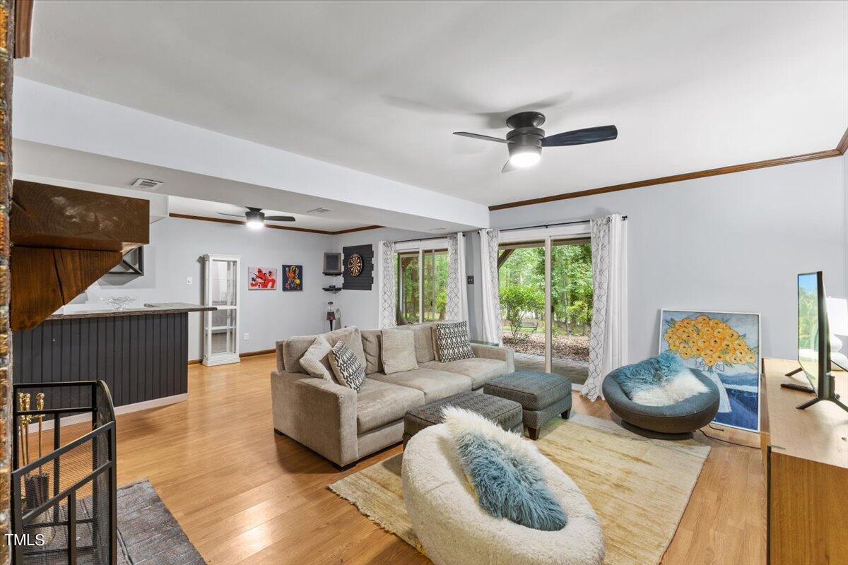 6713 Laurdane Road Raleigh, NC 27613 - Photo 26 of 47 a living room with furniture and a large window
