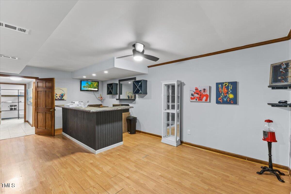 6713 Laurdane Road Raleigh, NC 27613 - Photo 29 of 47 a kitchen with a refrigerator and a sink
