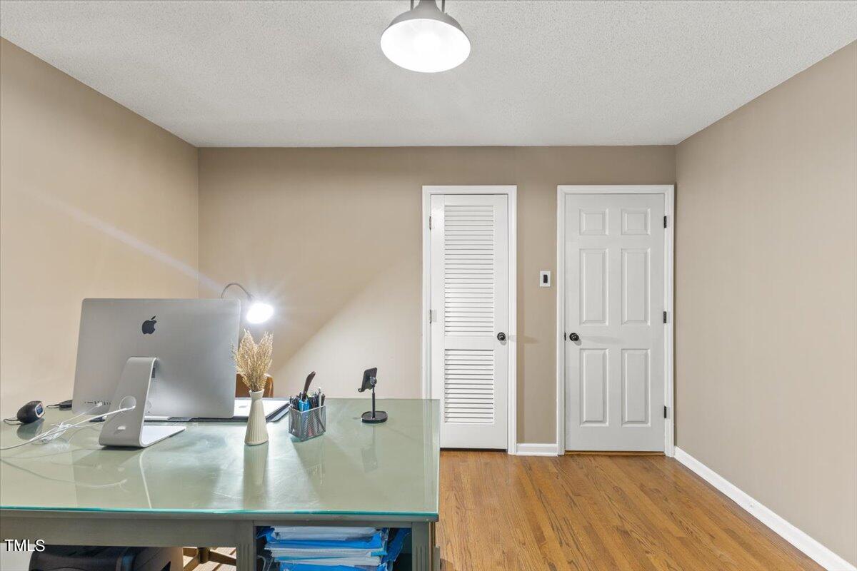 6713 Laurdane Road Raleigh, NC 27613 - Photo 30 of 47 a kitchen with kitchen island a sink appliances and cabinets