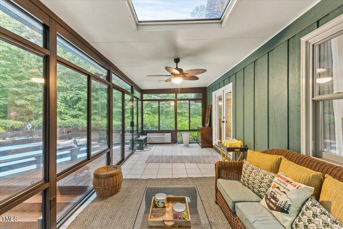 6713 Laurdane Road Raleigh, NC 27613 - Photo 39 of 47 a living room with furniture and large windows