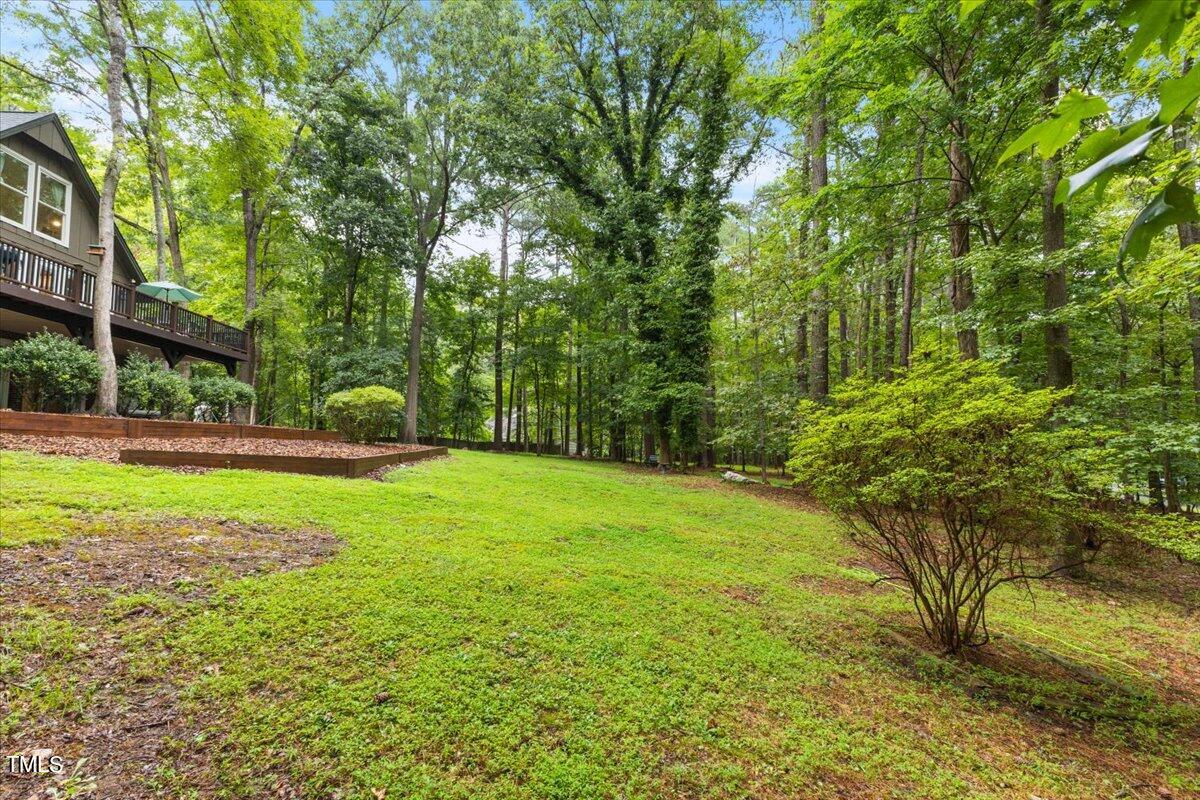6713 Laurdane Road Raleigh, NC 27613 - Photo 4 of 47 a view of a house with a yard
