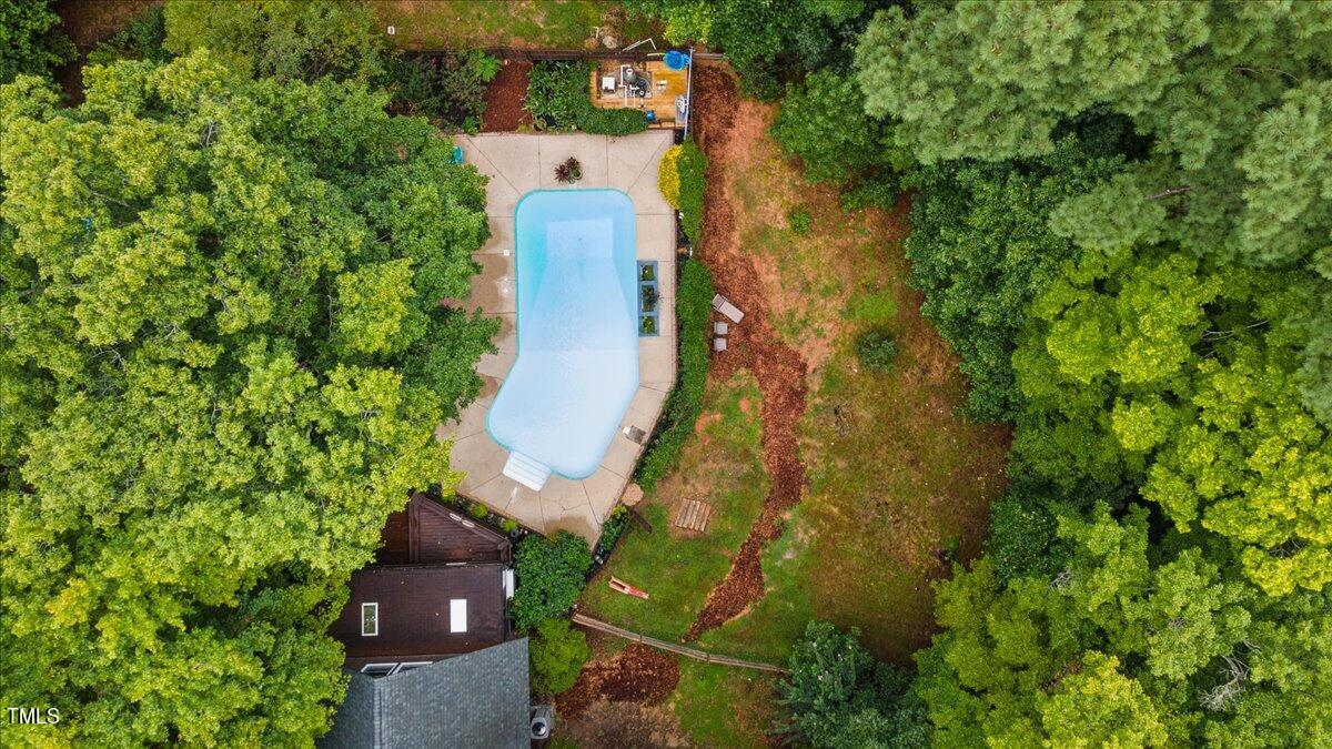 6713 Laurdane Road Raleigh, NC 27613 - Photo 45 of 47 an aerial view of residential house with outdoor space and trees all around