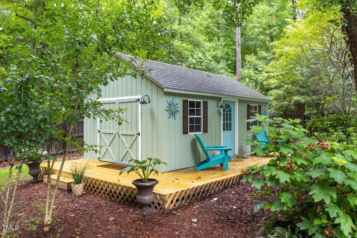 6713 Laurdane Road Raleigh, NC 27613 - Photo 47 of 47 a view of a house with a yard and sitting area