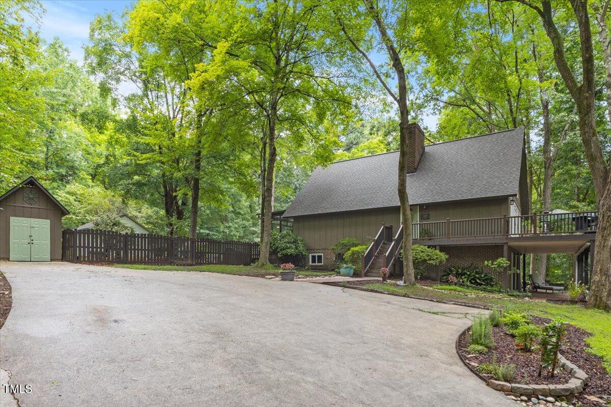 6713 Laurdane Road Raleigh, NC 27613 - Photo 5 of 47 front view of a house with a garden