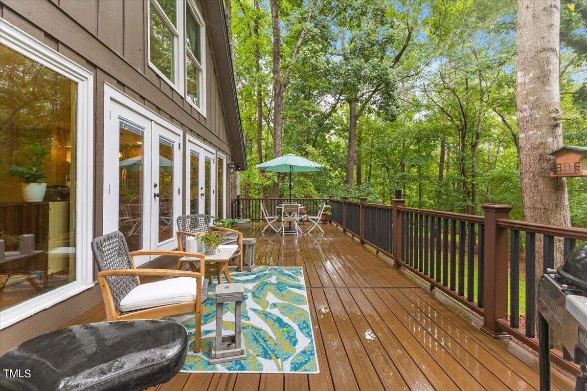 6713 Laurdane Road Raleigh, NC 27613 - Photo 8 of 47 a view of balcony with furniture and outdoor seating