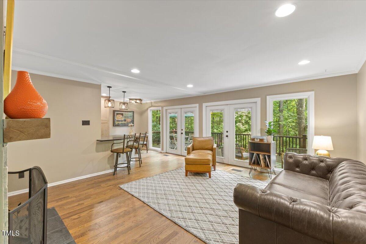 6713 Laurdane Road Raleigh, NC 27613 - Photo 10 of 47 a living room with furniture and a large window