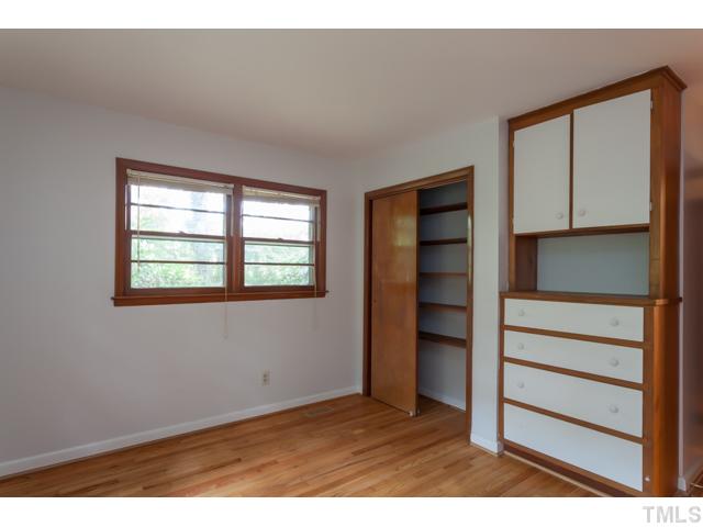 11709 Strickland Road Raleigh, NC 27613 - Photo 13 of 25 a view of an empty room with a closet