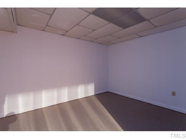 11709 Strickland Road Raleigh, NC 27613 - Photo 21 of 25 a view of an empty room
