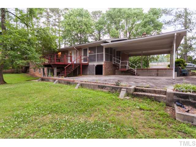 11709 Strickland Road Raleigh, NC 27613 - Photo 24 of 25 a view of a house with backyard porch and sitting area