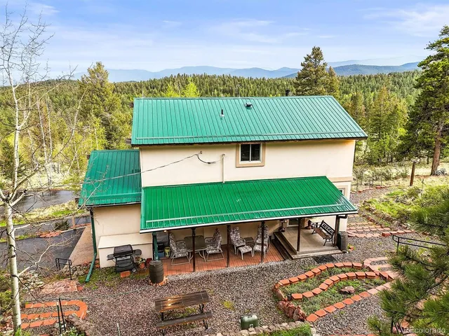 a view of staircase with railing and a window