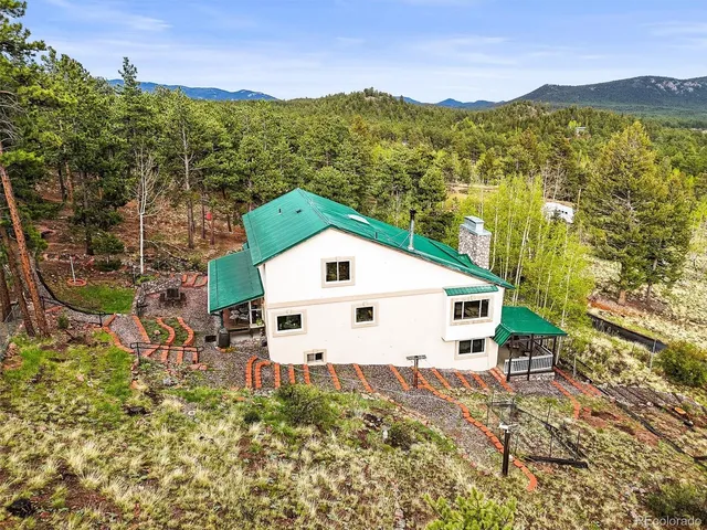 a bedroom with a bed and curtain