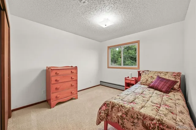 a bathroom with a sink shower and a mirror