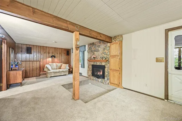 a view of a house with a wooden deck