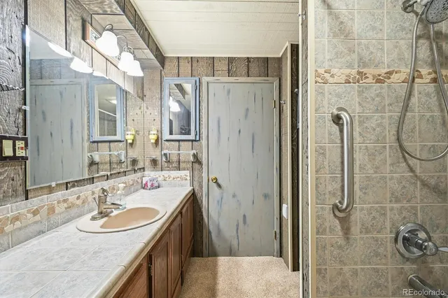 a bathroom with a black and white checkered floor