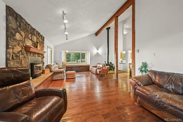 a kitchen with stainless steel appliances a stove sink microwave and cabinets