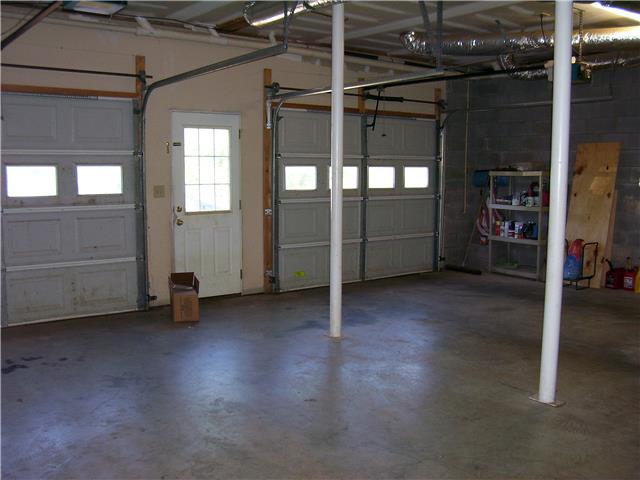 1075 Cliff White Road Columbia, TN 38401 - Photo 17 of 20 Oversized 2 car garage has plenty of space and automatic garage door openers, plus a service door for your convenience.