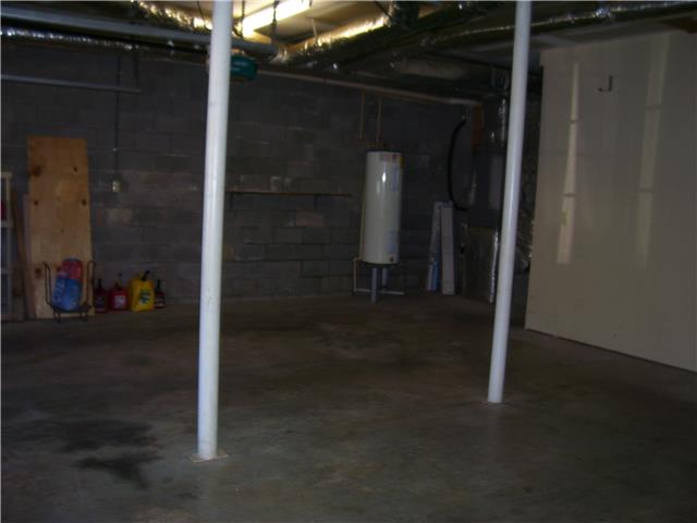 1075 Cliff White Road Columbia, TN 38401 - Photo 18 of 20 There is additional storage space under the stairs, plus the entry to the crawl space.
