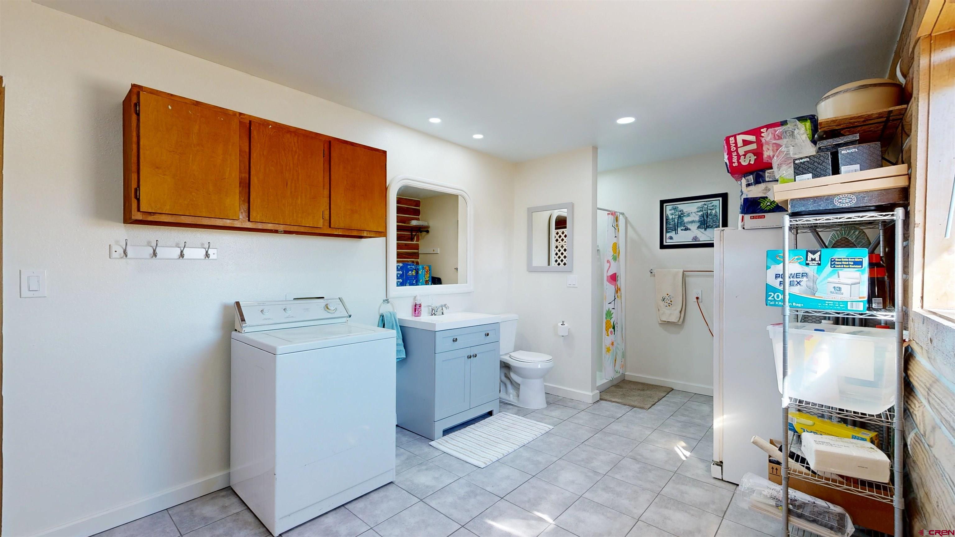 2083 Pioneer Road Delta, CO 81416 - Photo 31 of 45 a storage room with washer and dryer