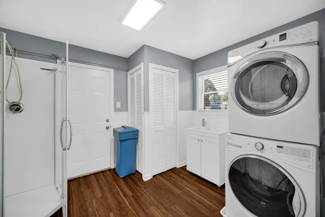 a view of a hallway with washer and dryer