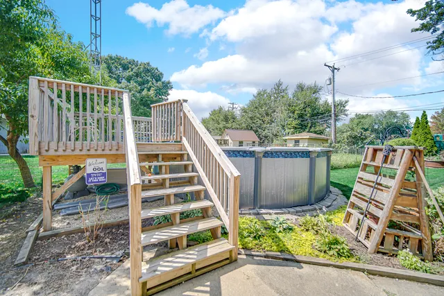 a view of a wooden deck and a yard view
