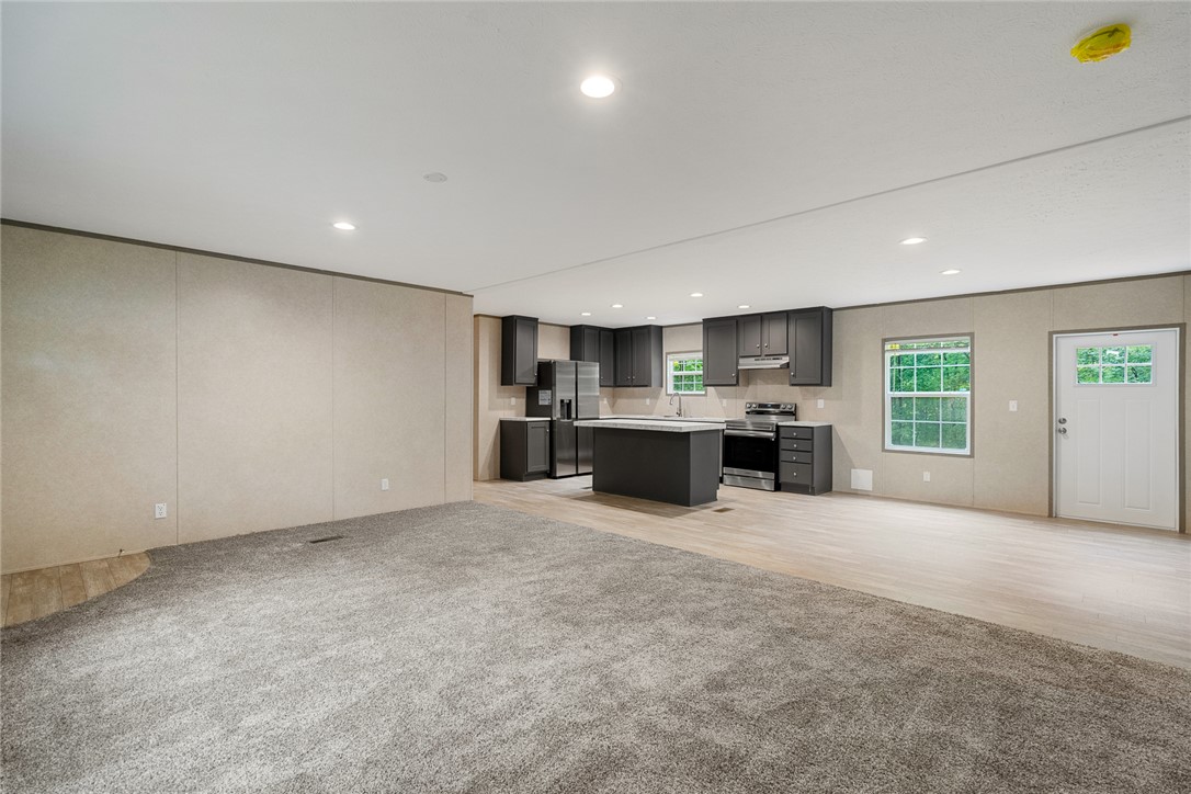 419 Austin Drive Anderson, SC 29624 - Photo 12 of 36 This expansive open concept space features a modern kitchen and inviting living area.