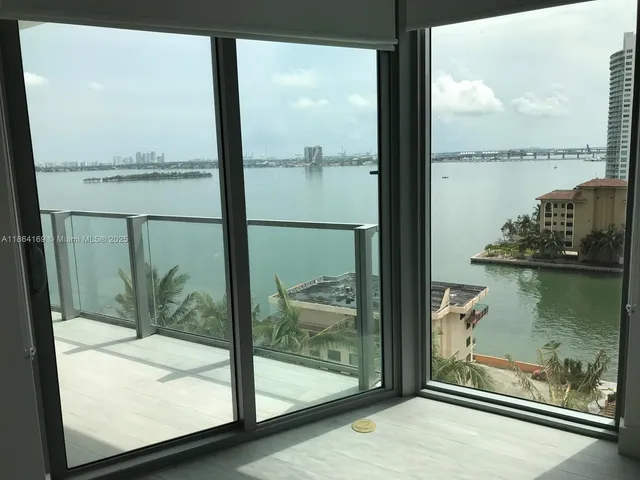 a view of a glass door and the window