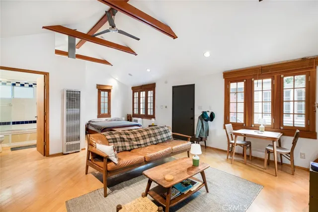 a kitchen with stainless steel appliances granite countertop a stove a refrigerator and a microwave