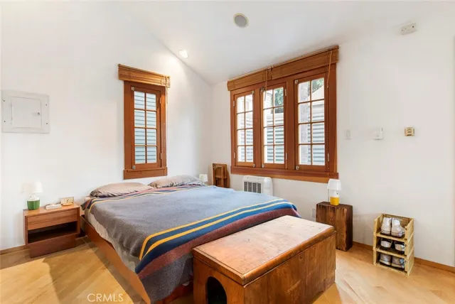 a bathroom with a granite countertop sink a mirror a bathtub and a shower