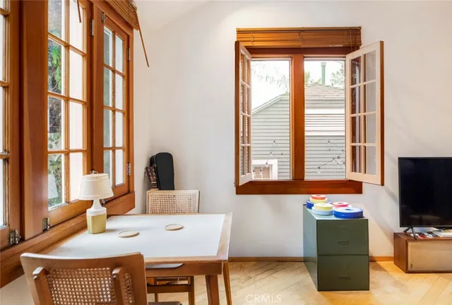 a view of a chair and table in the balcony