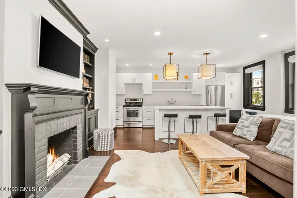 a living room with furniture and a fireplace