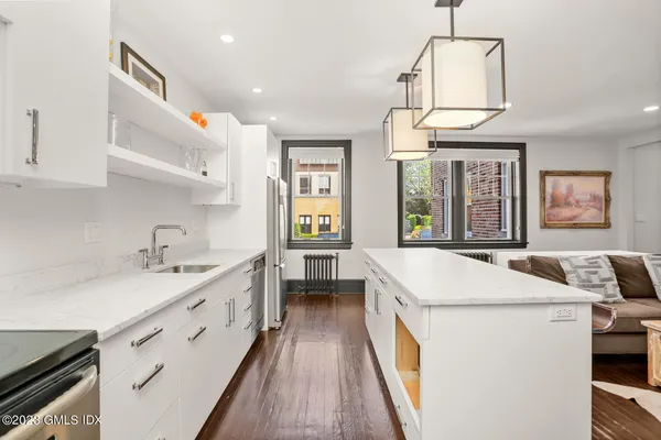 a kitchen that has a lot of cabinets in it