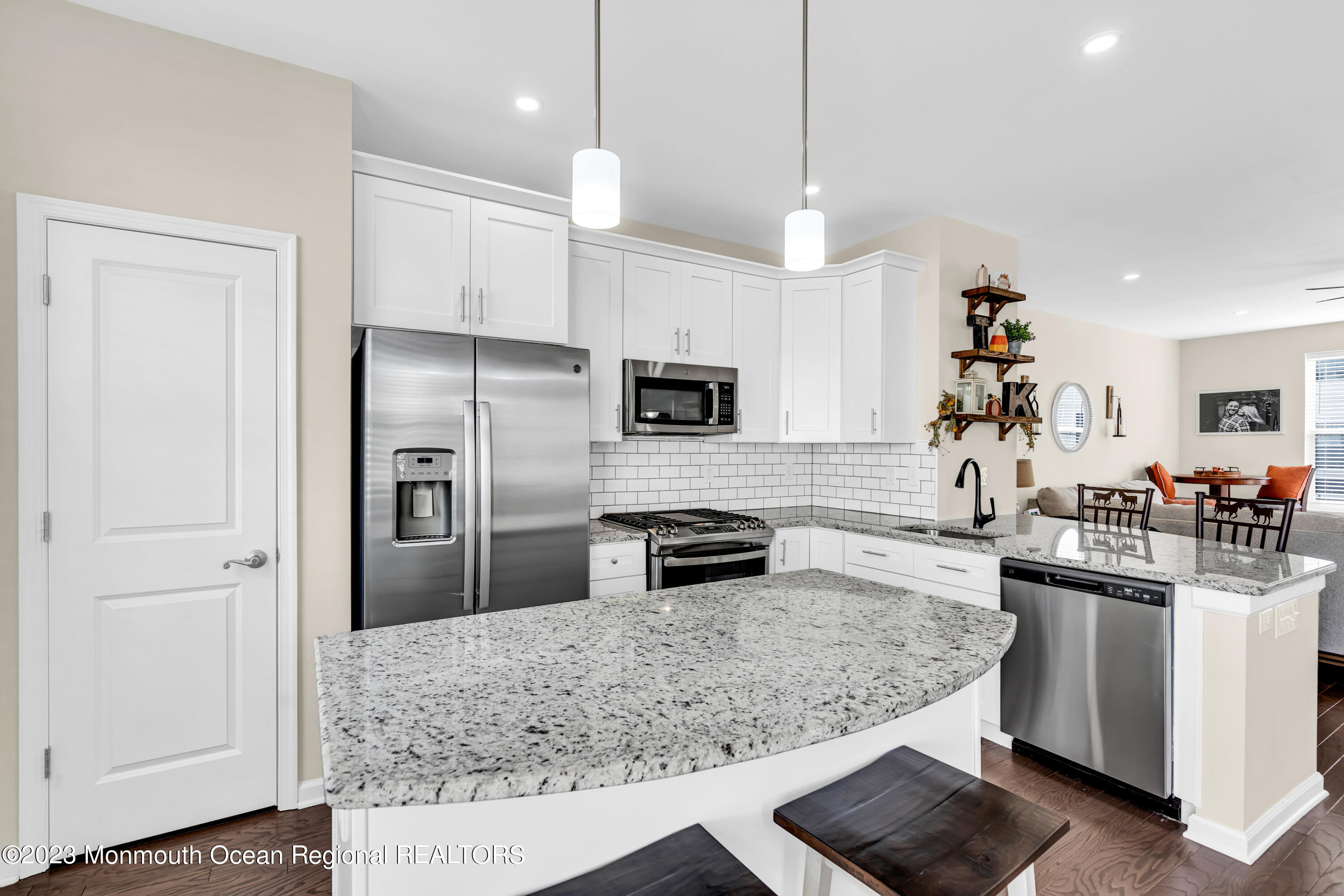 201 Revival Road Brick, NJ 08723 - Photo 14 of 41 a kitchen with white cabinets and stainless steel appliances