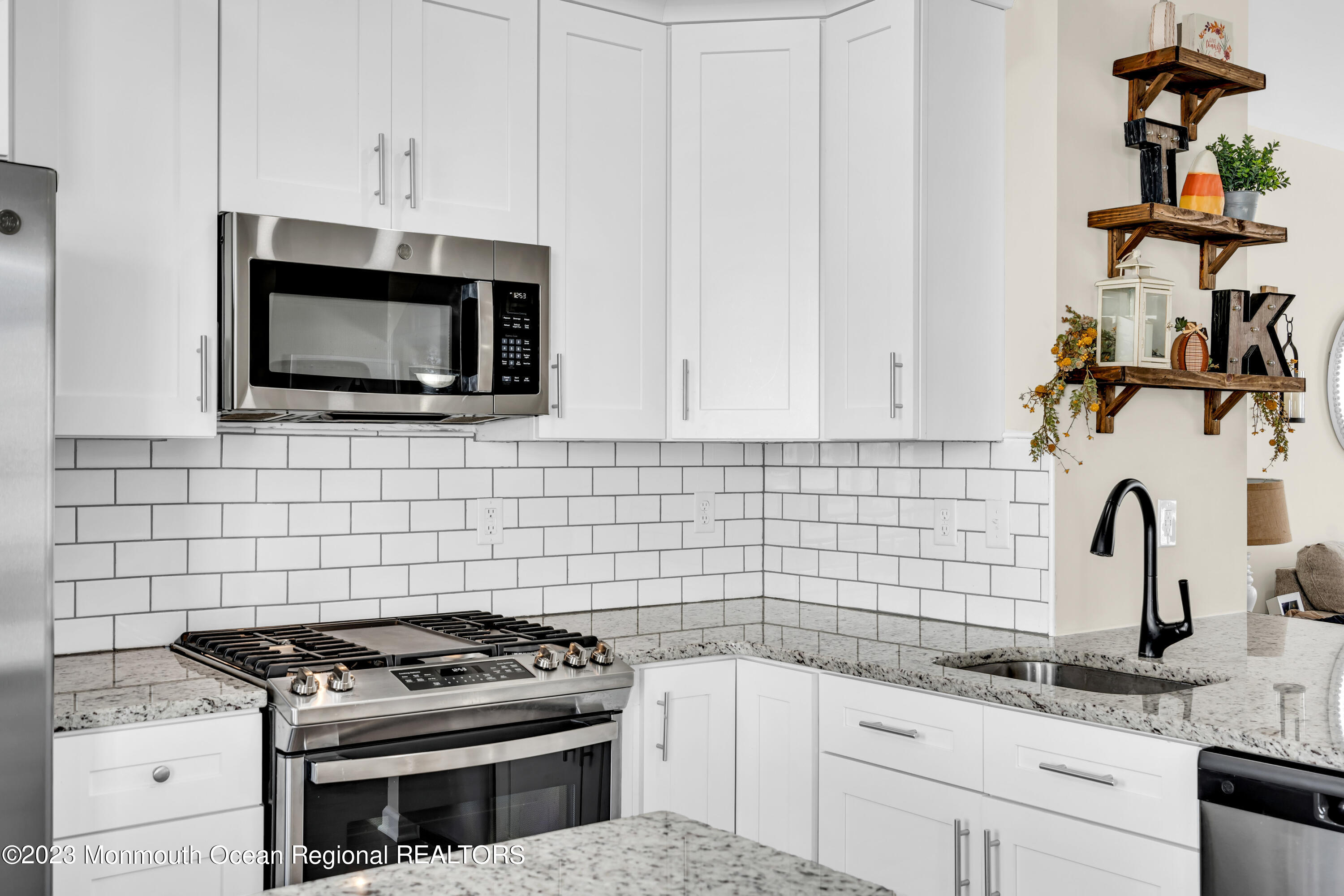 201 Revival Road Brick, NJ 08723 - Photo 15 of 41 a kitchen with granite countertop a stove and a sink