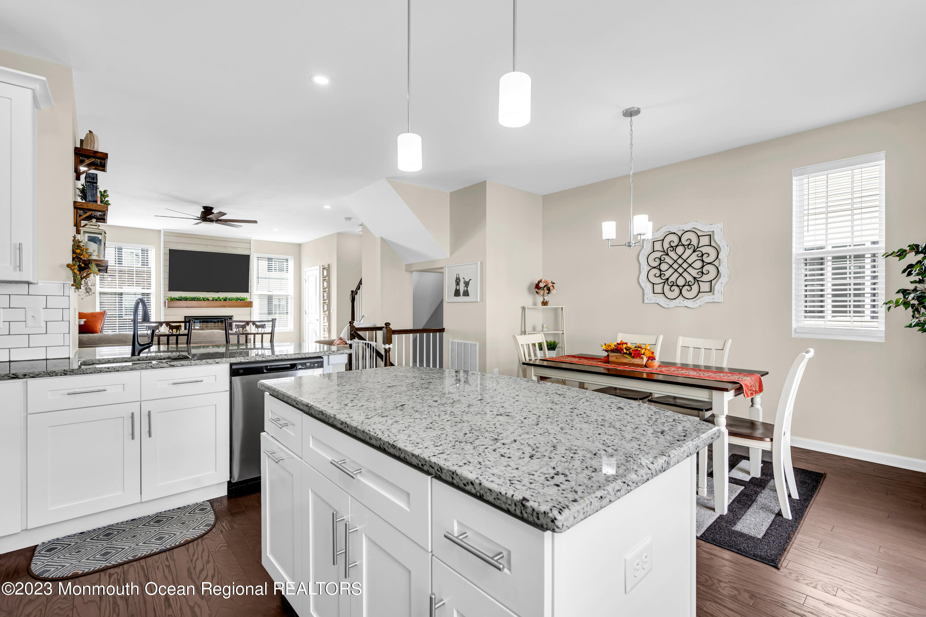 201 Revival Road Brick, NJ 08723 - Photo 18 of 41 a kitchen with stainless steel appliances granite countertop a sink dishwasher a stove and a refrigerator with wooden floor