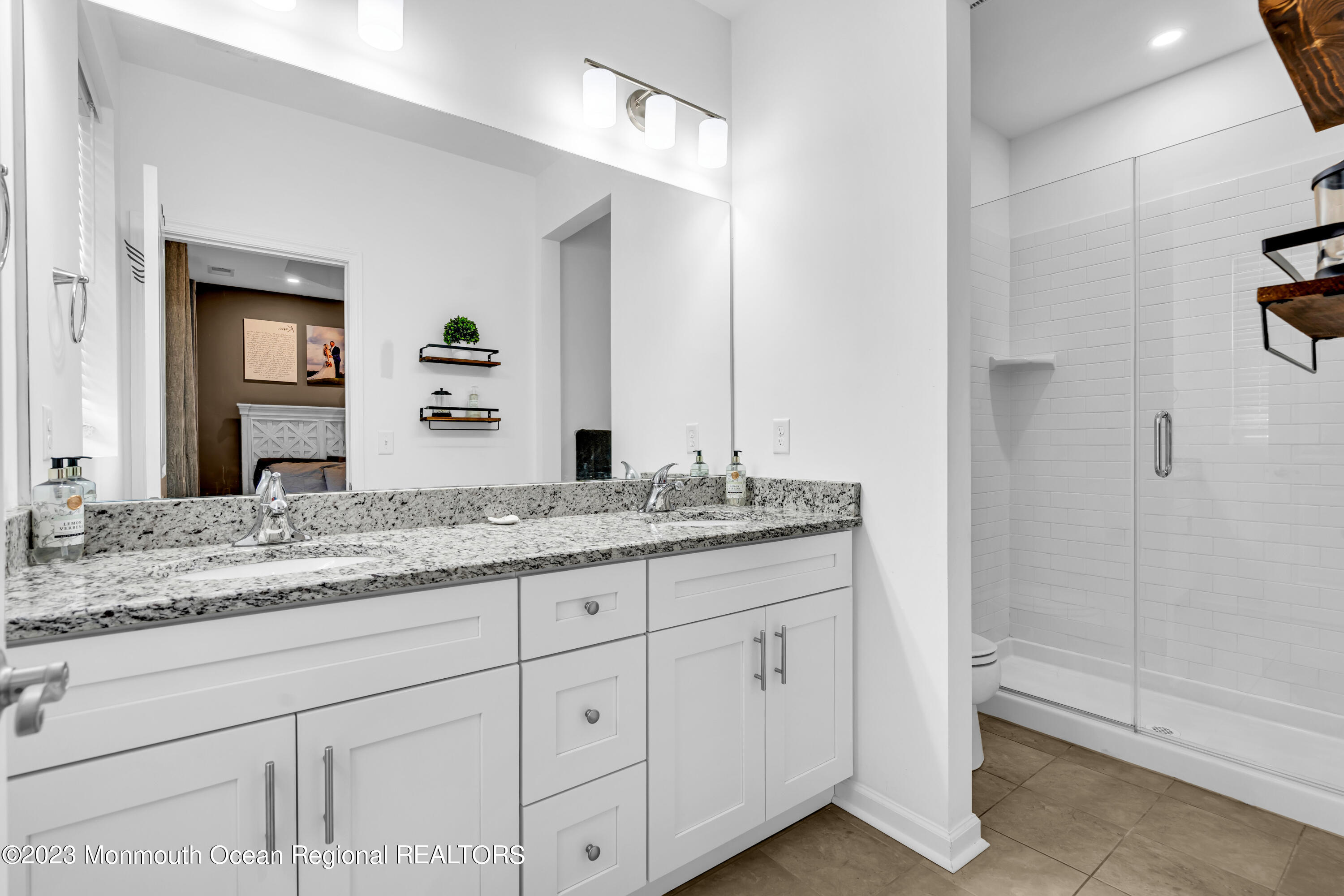 201 Revival Road Brick, NJ 08723 - Photo 30 of 41 a bathroom with a granite countertop sink and a mirror