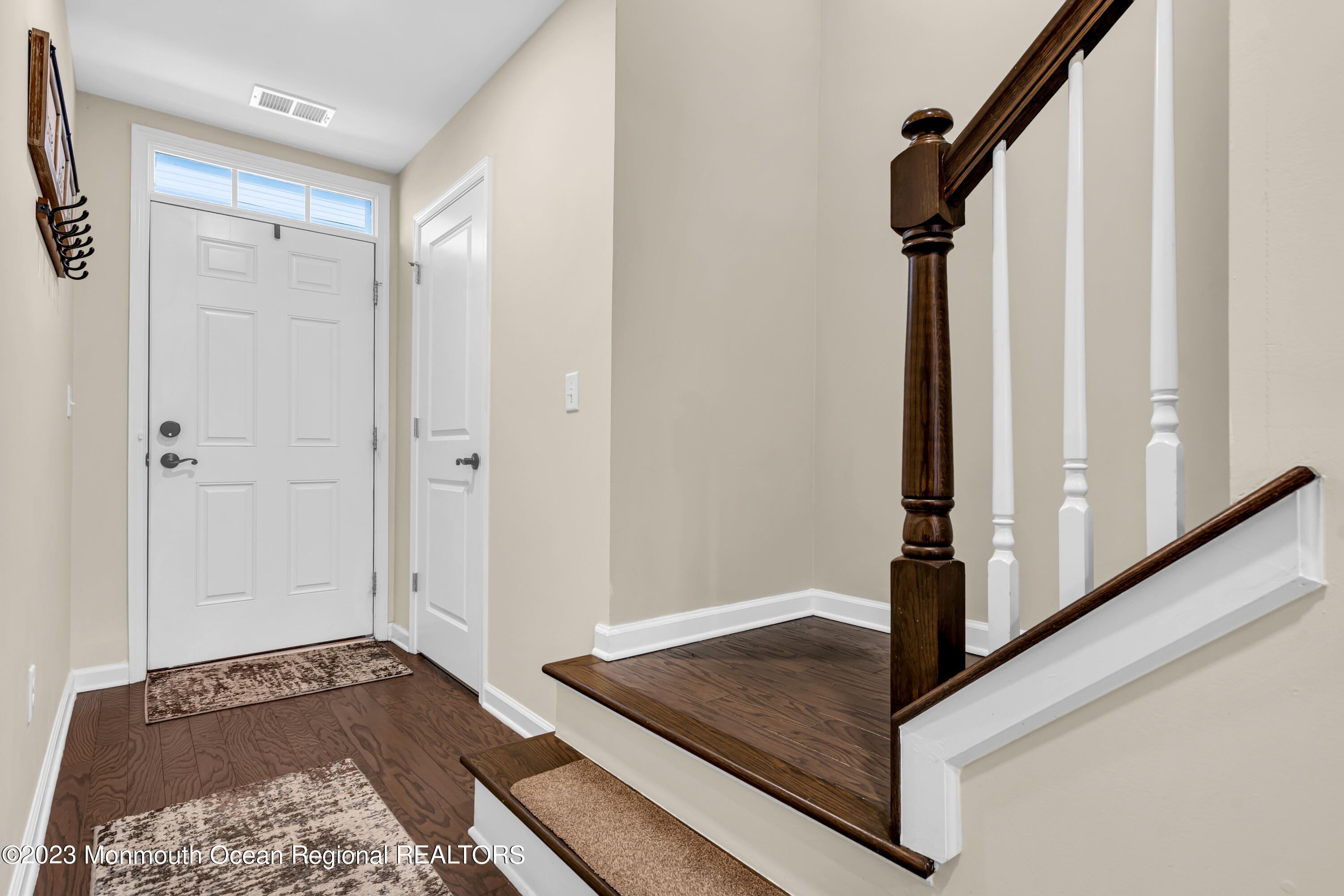 201 Revival Road Brick, NJ 08723 - Photo 3 of 41 a view of a hallway to a room with windows