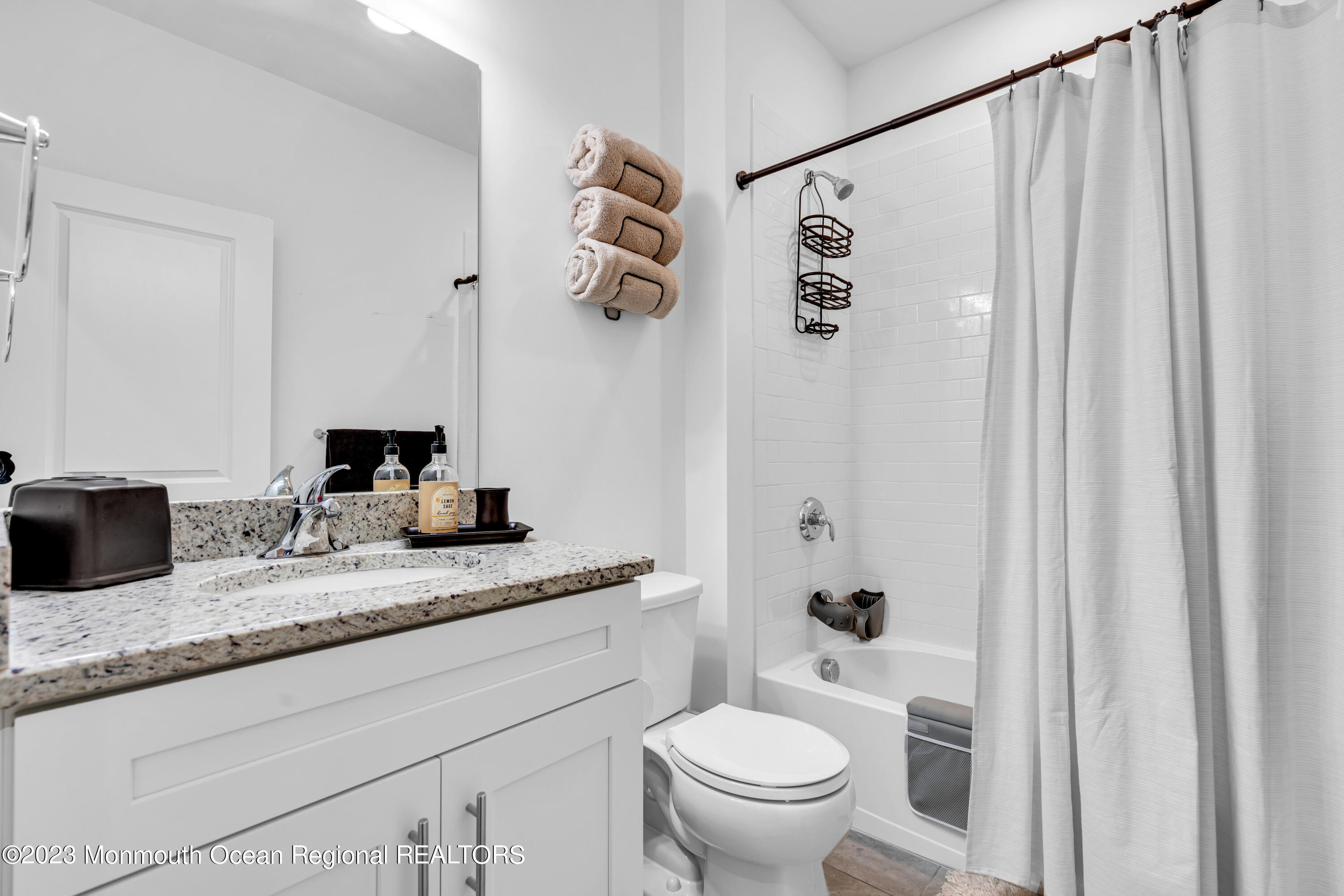 201 Revival Road Brick, NJ 08723 - Photo 34 of 41 a bathroom with a granite countertop sink and a mirror