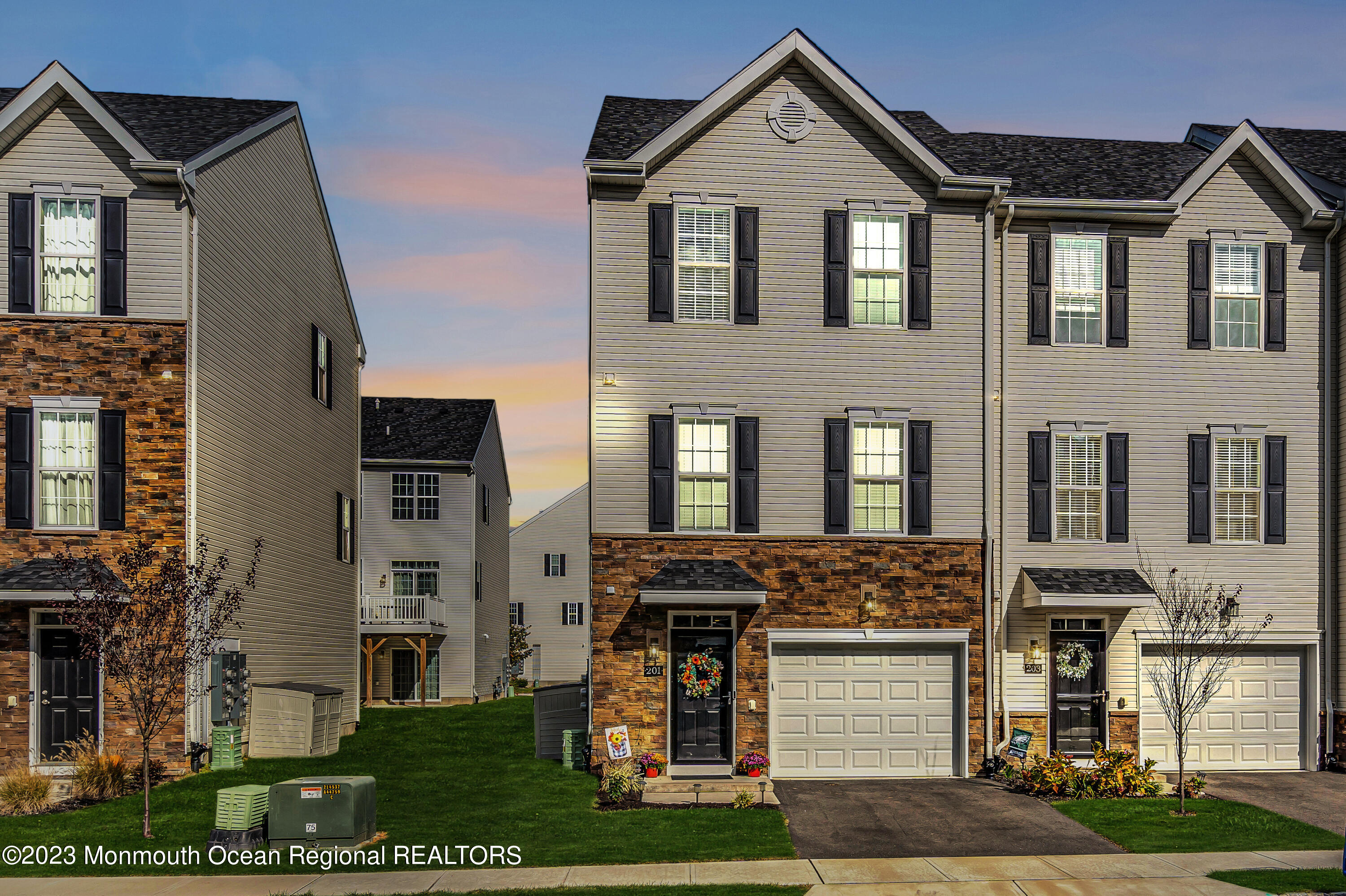 201 Revival Road Brick, NJ 08723 - Photo 41 of 41 a front view of a residential apartment building with a yard
