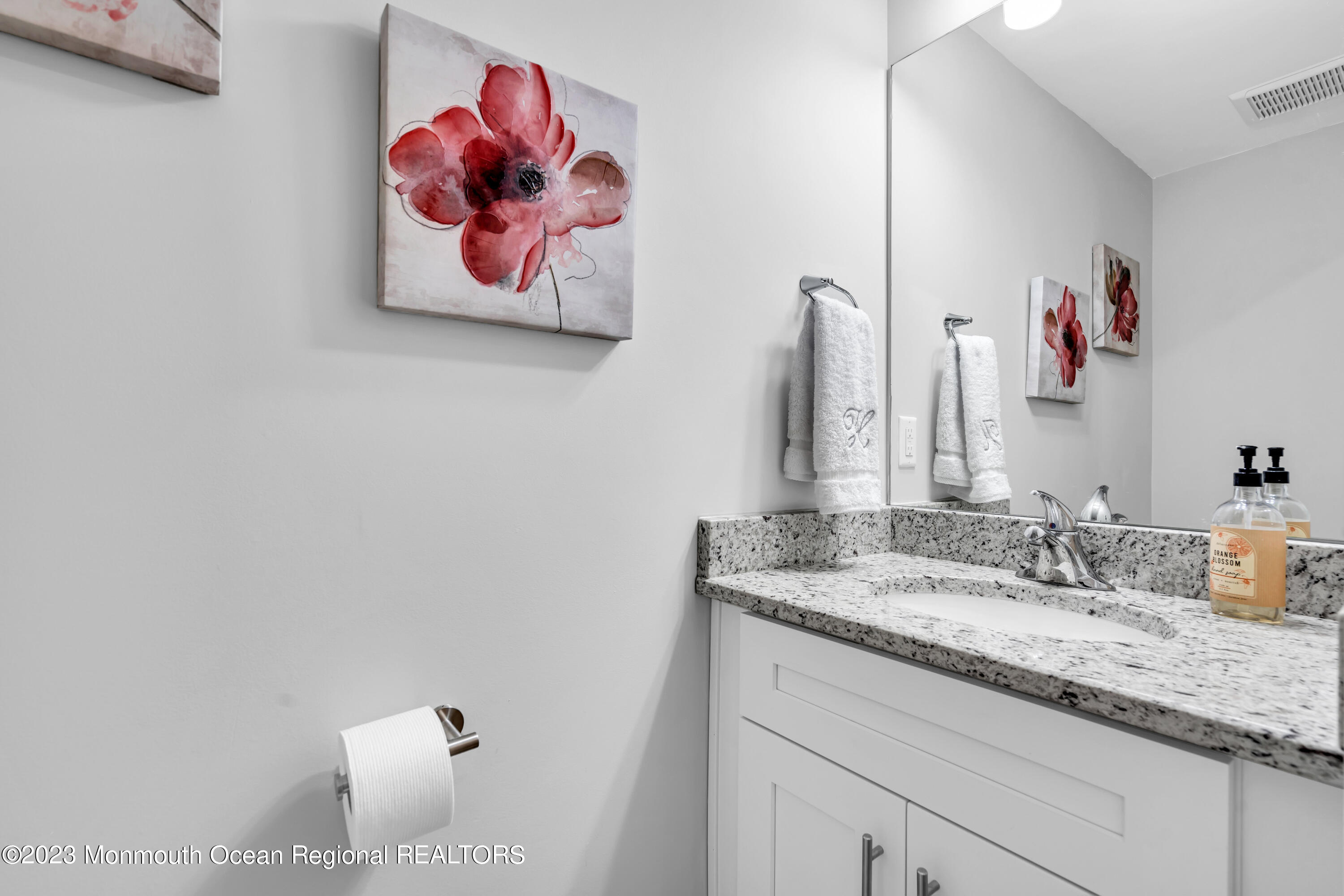 201 Revival Road Brick, NJ 08723 - Photo 10 of 41 a bathroom with a granite countertop sink a vanity and a mirror