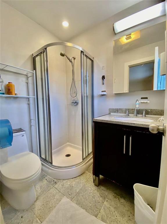 1244 Avenue X, Unit 2A Brooklyn, NY 11235 - Photo 13 of 14 a bathroom with a sink toilet and shower
