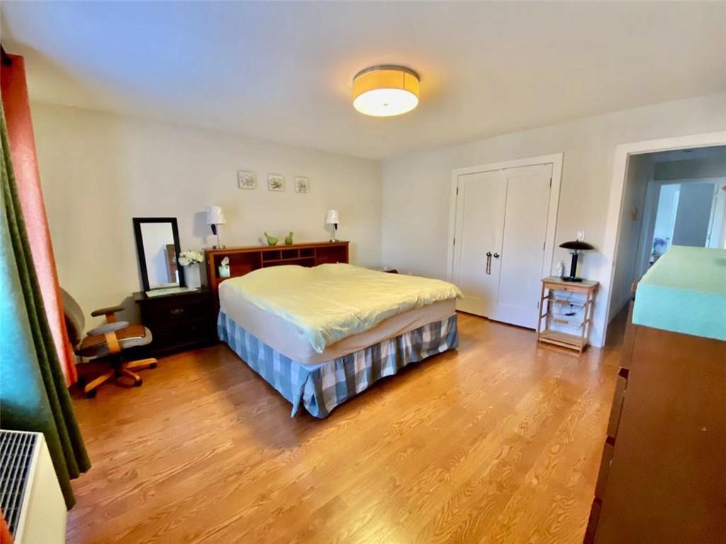 1244 Avenue X, Unit 2A Brooklyn, NY 11235 - Photo 4 of 14 a bedroom with a bed and a dresser