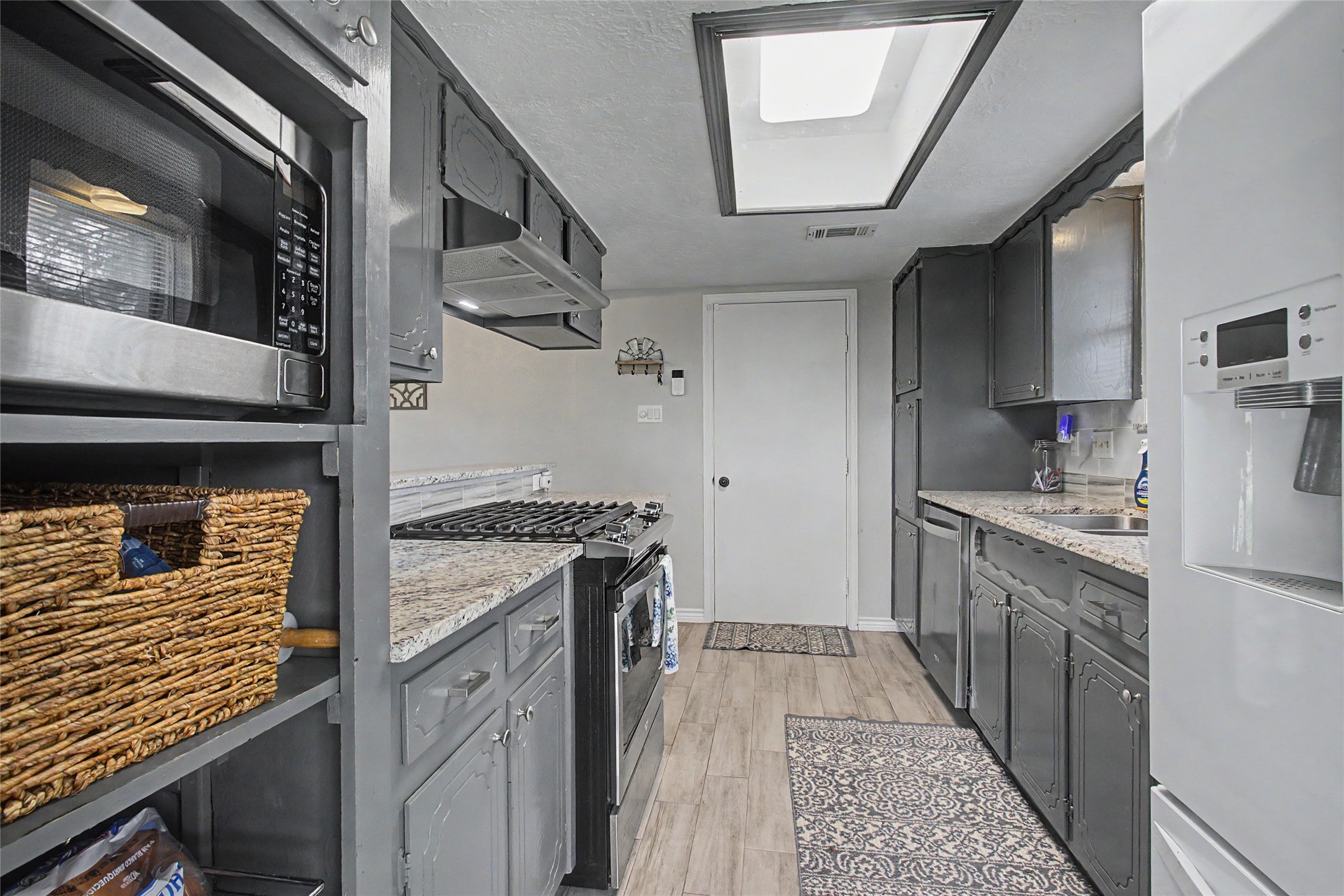 327 Fir Ridge Drive Huffman, TX 77336 - Photo 11 of 25 Another view of your updated kitchen with recently painted cabinets.
