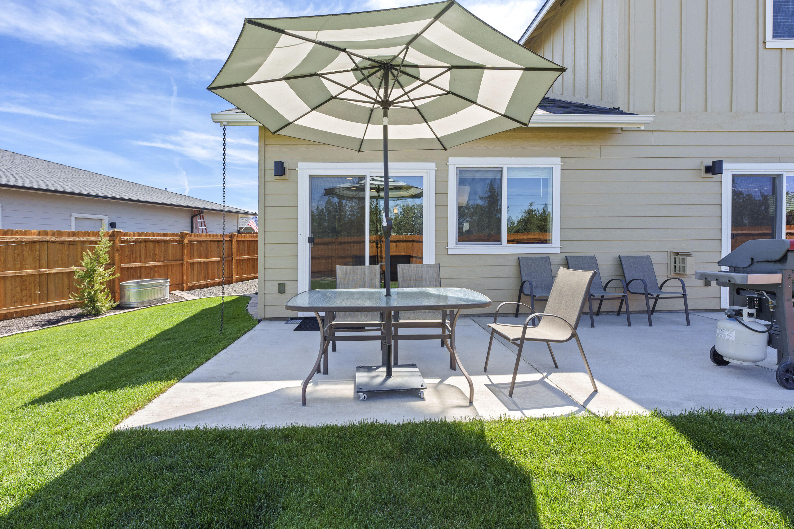 4999 Southwest Yew Place Redmond, OR 97756 - Photo 35 of 50 a patio with a table and chairs