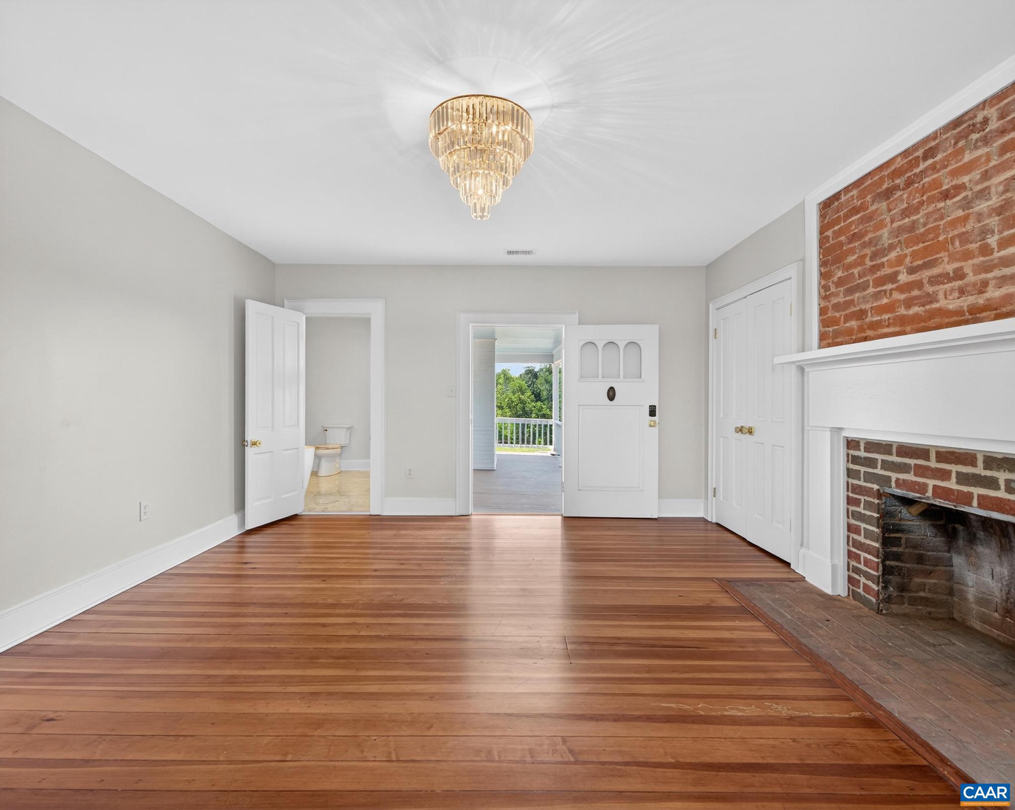 481 Race Ground Road Somerset, VA 22972 - Photo 22 of 53 a view of empty room with wooden floor and fireplace