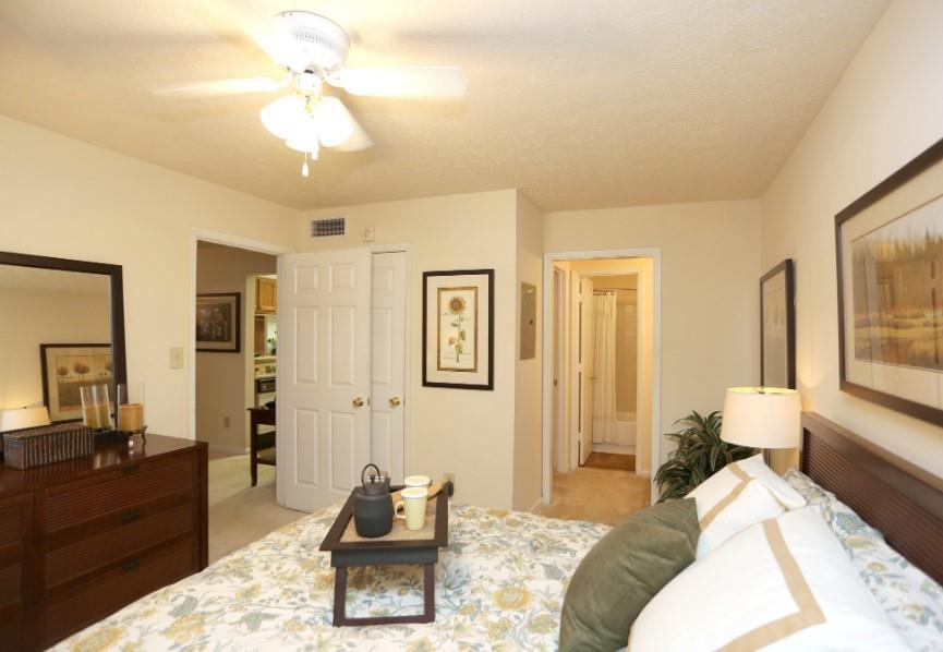 3450 K Jones Mill Road, Unit 218 Norcross, GA 30092 - Photo 10 of 29 a bedroom with a bed and wooden floor