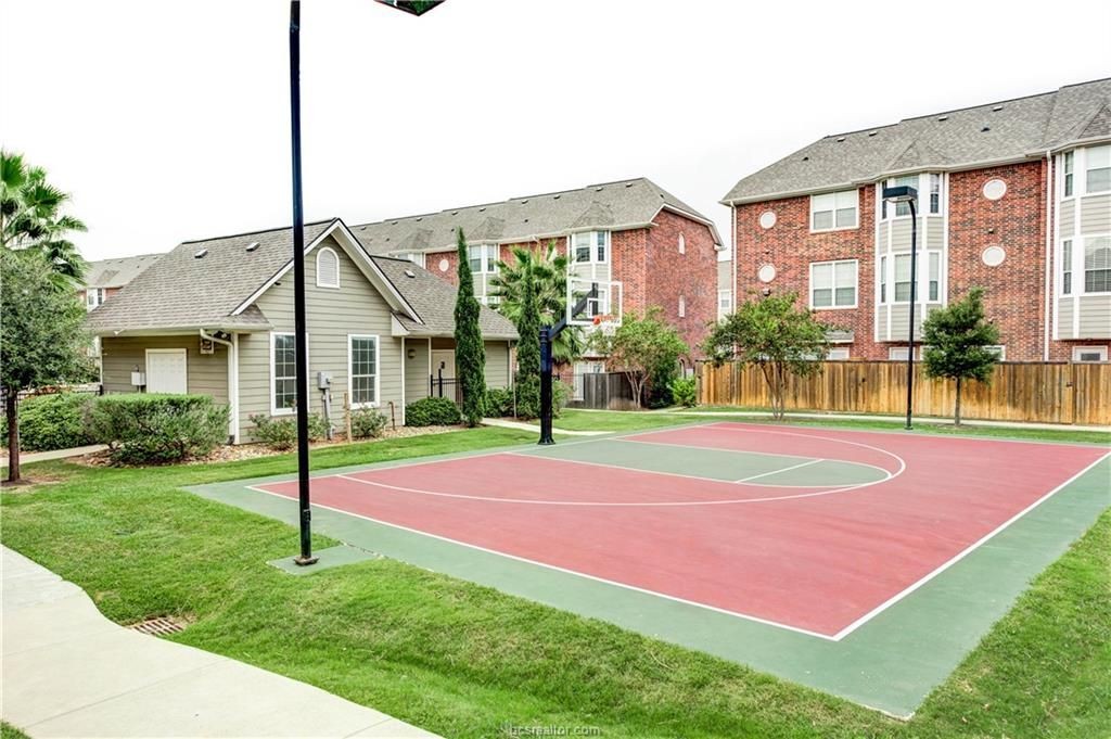 1198 Jones-Butler Road, Unit 2901 College Station, TX 77840 - Photo 21 of 22 View of sport court with a lawn
