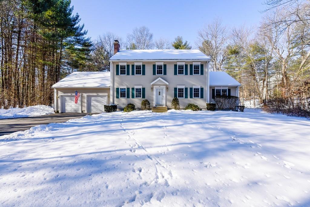 a front view of a residential apartment building with a yard